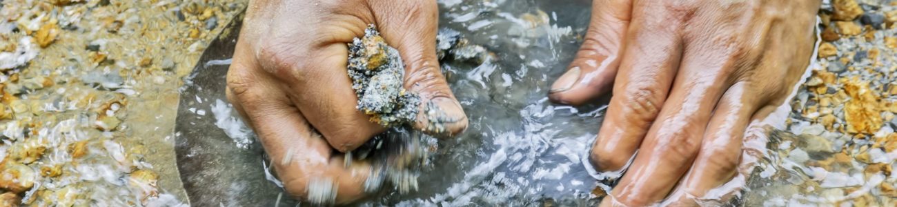 Gold Panner Closeup of hands gold panning in a river