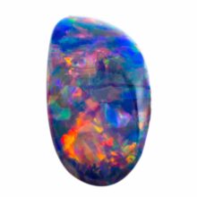 Polished natural colorful blue iridescent opal on white background